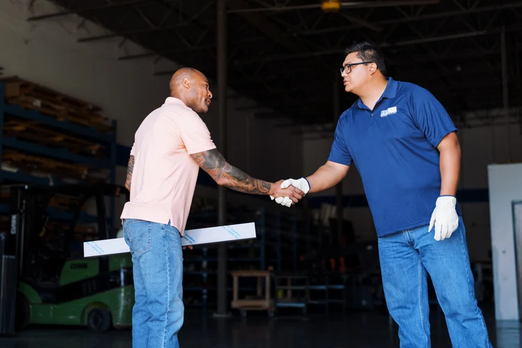 metal-supermarkets-customer-employee-handshaking